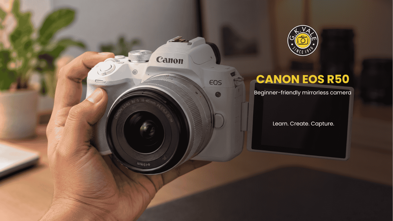Canon EOS R50 held in one hand with its vari-angle screen flipped to face forward